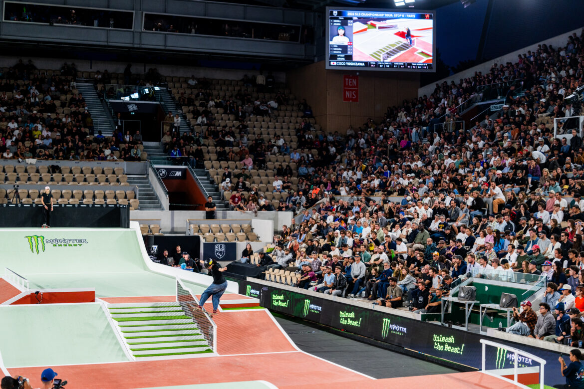 Coco Yoshizawa performs a hurricane grind in front of the crowd during SLS Paris 2026 at Roland-Garros.